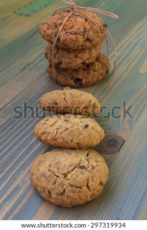 Sweetmeats. Two types of oatmeal cookies with sunflower seeds and raisins. Some related cord with bow, a second overlapping ends. Perfect for a day trip, party, meeting over coffee.