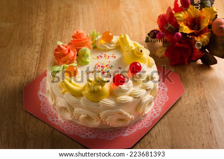 Cream cake with Jelly on the wooden table