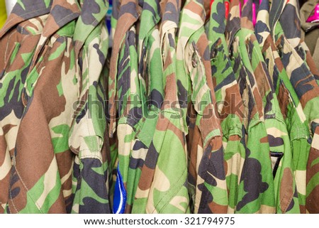 closeup military shirt on hanger in shop