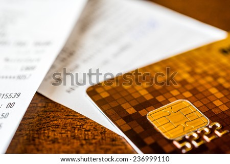 Credit card and checks from shopping on the table