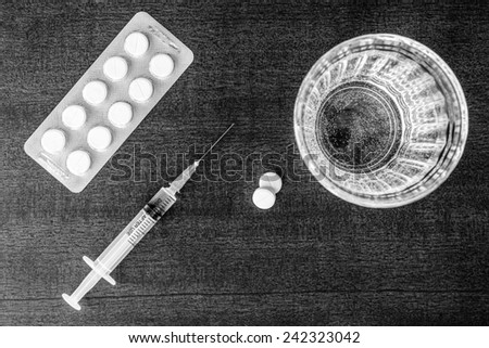 Cure the disease, an injection syringe and take the pills. Top view