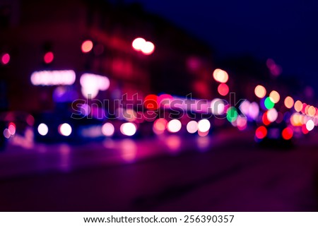 The lights of the big city, night avenue. Image in red-blue toning