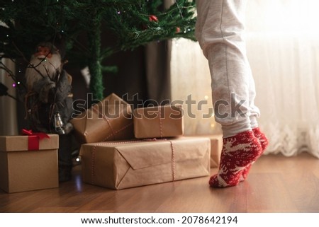 Similar – Image, Stock Photo Child decorating the tree seen from behind