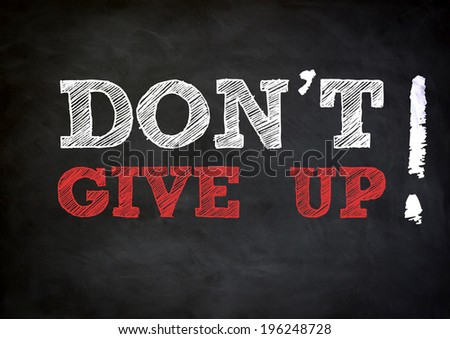 DON'T GIVE UP written concept on chalkboard