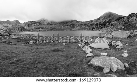 Black and white romanian mountain landscape with tents