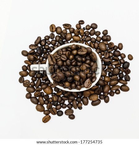 Fresh coffee beans in and out of a white cup with white background