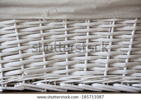 Texture from a box with natural wicker painted in white and textile white piece