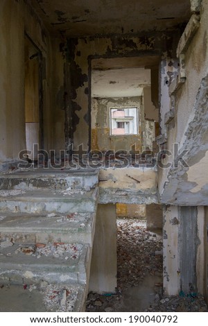 Interior stairs from abandoned block of flats under construction. Brick and cement textures