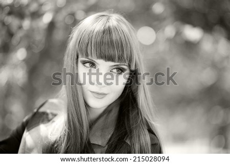 Black and white portrait of a beautiful, caucasian, young, long haired woman posing in urban locations with natural background