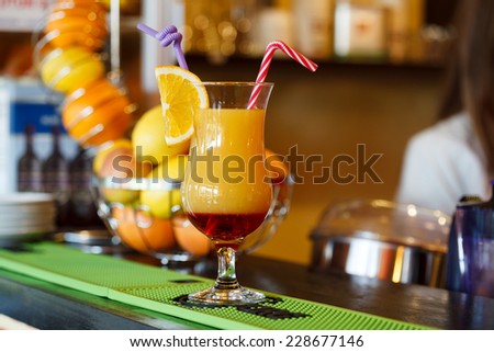 Campari orange drink at the bar with bar design in the background