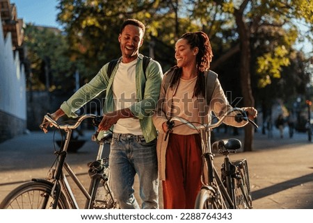 Similar – Image, Stock Photo Ethnic woman with bicycle on street