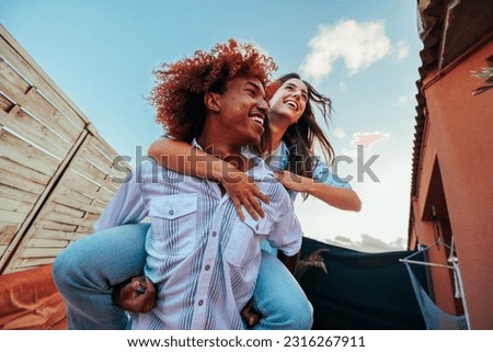 Similar – Image, Stock Photo Man and woman enjoying sunset in autumn mountains