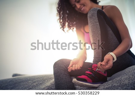 Similar – Image, Stock Photo Sporty woman tying laces on sneakers before training