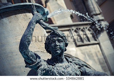 Right near the Neues Rathaus at the Marienplatz in Munich, is a small fountain, the Fischbrunnen or Fish Fountain. Originally designed in 1864, toned image.