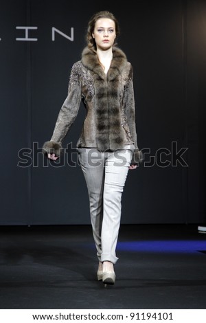 MOSCOW - DECEMBER 16: A model displays a creation by Russian designer Maria Shosheva, during Moscow, fashion Show in Crocus TOPLINE. on December 16, 2011 in Moscow, Russia.