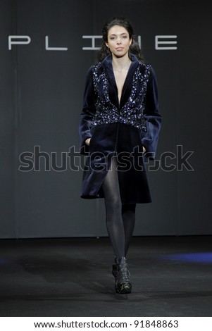MOSCOW - DECEMBER 16: A model displays a creation by Russian designer Maria Shosheva, during Moscow, fashion Show in Crocus TOPLINE. on December 16, 2011 in Moscow, Russia.