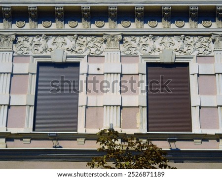 Similar – Foto Bild zwei geschlossene Rollläden auf einer grauen schäbigen Fassade