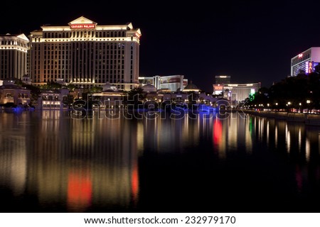 Las Vegas, Nevada, USA - Sept. 25, 2014: Buildings at the Caesars Palace casino and hotel reflecting in the fountain lake a night along the Las Vegas Blvd in Las Vegas, Nevada, USA on Sept. 25, 2014
