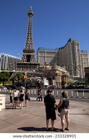 Las Vegas, Nevada, USA - Sept 22, 2014:Tourist sightseeing on the Las Vegas Strip in front of Eiffel Tower replica at the Paris Hotel and Casino,in Las Vegas, Nevada, USA - Sept 22, 2014.