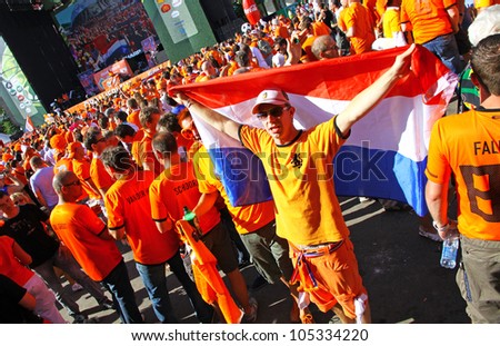 KHARKIV, UKRAINE - 13 JUNE: Holland football team supporters walk on a street of Kharkiv city before UEFA EURO 2012 game against Germany on 13 June, 2012 in Kharkiv, Ukraine
