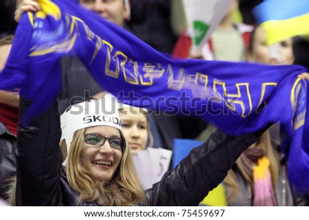 KYIV, UKRAINE - April 17: Unidentified Ukrainian fans celebrate during IIHF Ice-hockey World Championship DIV I Group B game against Great Britain on April 17, 2011 in Kyiv, Ukraine