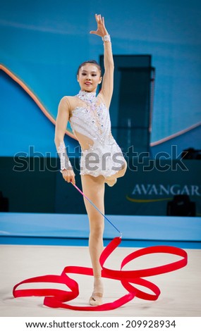 KYIV, UKRAINE - AUGUST 30, 2013: Senyue Deng of China performs during 32nd Rhythmic Gymnastics World Championship (Individual All-All-Around competition)