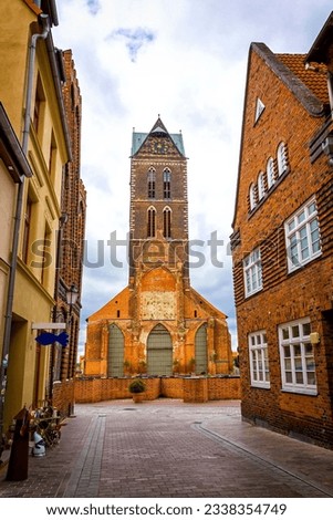 Similar – Image, Stock Photo Marienkirche in Wismar in the sunset.