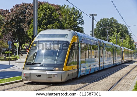 PORTO, PORTUGAL - JUNE 17, 2013: Light rail train of Metro do Porto, part of the public transport system of Porto city. First line of the system was opened in 2002