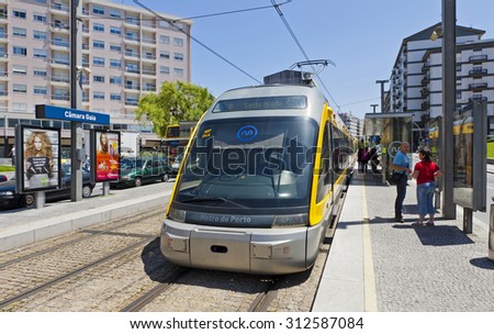 PORTO, PORTUGAL - JUNE 17, 2013: Light rail train of Metro do Porto, part of the public transport system of Porto city. First line of the system was opened in 2002
