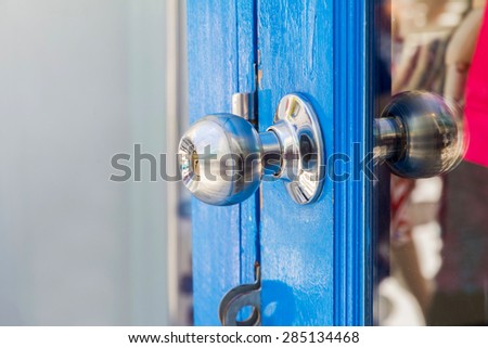 blue door with grill