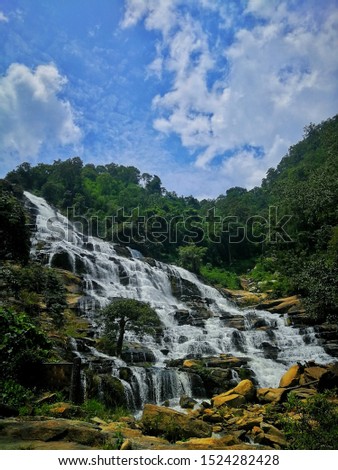 A mysterious waterfall in the foreground is the leaves changing color in the Da Lat Plateau, Thailand. This waterfall is known as the first waterfall in Southeast Asia that attracts many tourists to v Stock fotó © 