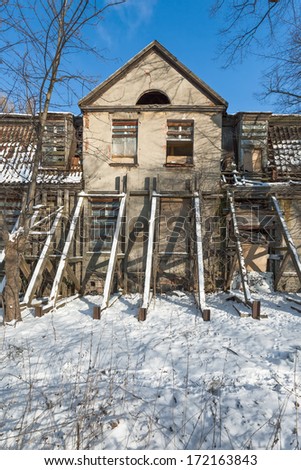The ruins of an old mansion and lying snow