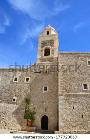 Monastery Toplou, Greece. The walls of the monastery on a background of blue sky.