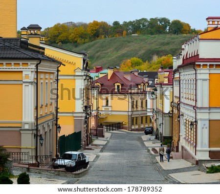 Street European city. Colored houses, cobblestone road.