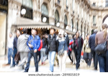 Shopping crowd walking on sidewalk