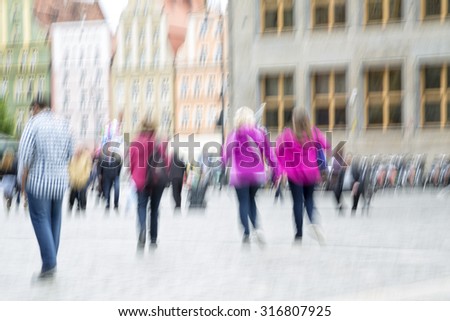 Crowd of shopping people in the city with zoom effect