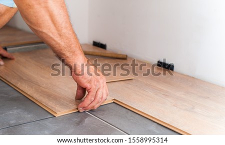 The master sets the laminate that is laid on the substrate Photo stock © 