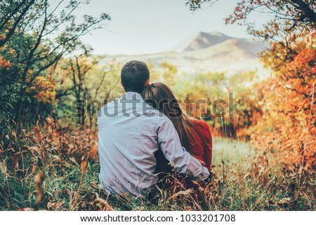 Similar – Image, Stock Photo Loving couple sitting on car on road near forest