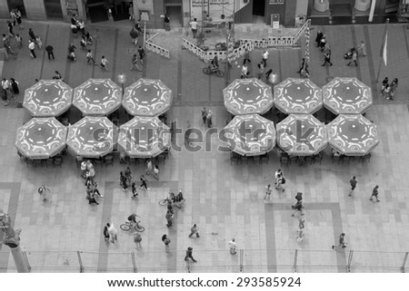 MUNICH, GERMANY - JUNE 3, 2015: Beautiful Weather Brings out Shoppers and Diners in Front of the City Hall on the Marienplatz in Munich, Germany.
