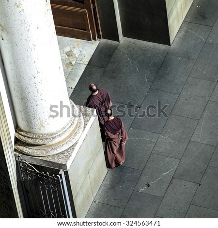 CAMPINAS, BRAZIL - SEPTEMBER 7, 2013: Two unidentified Franciscan Friars walking into a church