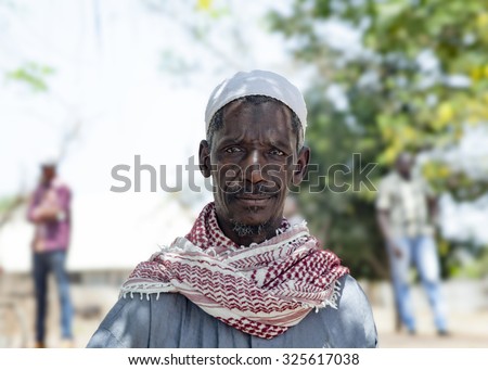 GABU, GUINEA-BISSAU - APRIL 4, 2014: Portrait of an African village chief heading to a council meeting