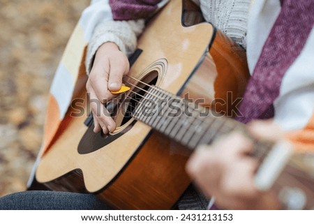 Similar – Image, Stock Photo Guitarist playing outdoors