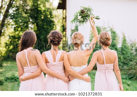Similar – Image, Stock Photo elegant bride with bridesmaids in the wedding morning preparation. Beautiful bride is dressed up an elegant wedding robe, bridesmaids in grey dresses