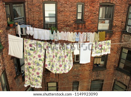 Similar – Image, Stock Photo Towels on clothesline between two trees on the campsite. In the background a caravan with awning.
