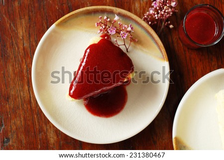 Japanese cotton cheese cake with strawberry sauce.