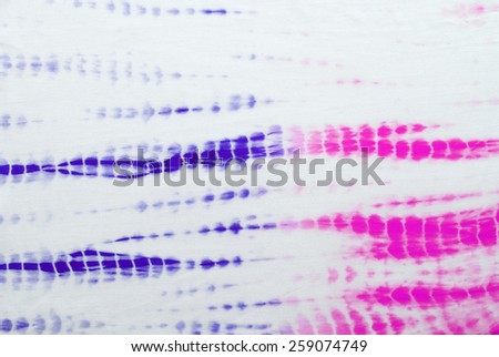 tie dyed pattern on cotton fabric for background.