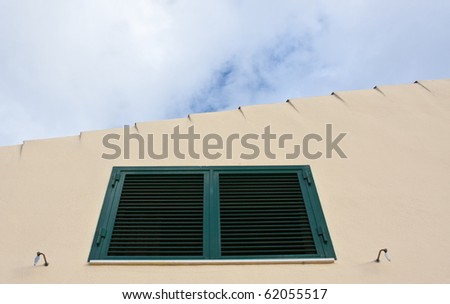 Metal window with roof up and the sky