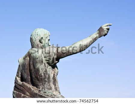 Roman statue of a man on blue sky
