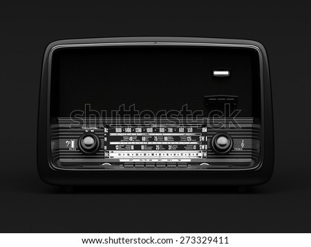 Black vintage radio on a black background
