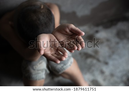closeup hands poor child begging  concept,  for poverty or hunger people, Human Rights. Stockfoto © 